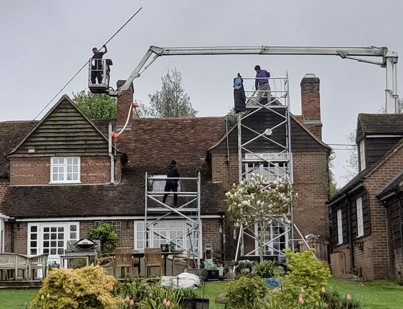 The Roof Moss Cleaners using cherry picker and scaffolding to clean roof safely and professionally in Maidenhead, Berkshire