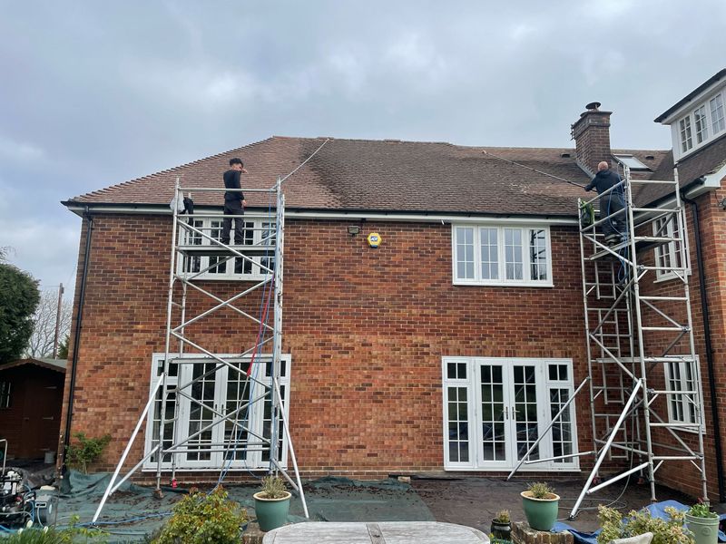 Roof cleaning carried out safely from scaffold towers by The Roof Moss Cleaners in Maidenhead